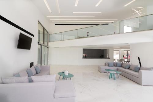 a living room with a couch and a table at Zante Sun Resort in Lithakia