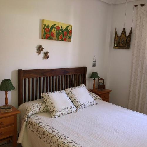 a bedroom with a bed with two pillows on it at Duplex Vera - Playa in Vera