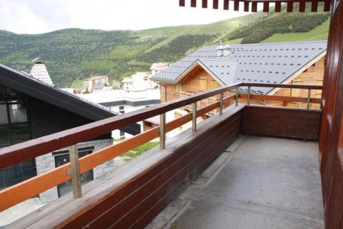 a balcony with a view of a mountain at L'ours blanc in LʼHuez