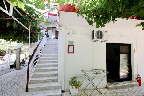 a stairway leading up to a white building at Guest House Bajceta in Herceg-Novi