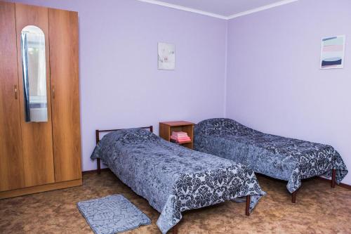 Кровать или кровати в номере Гостевой Дом Альтаир