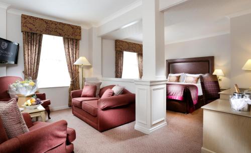 a living room filled with furniture and a couch at Macdonald Kilhey Court Hotel & Spa in Wigan