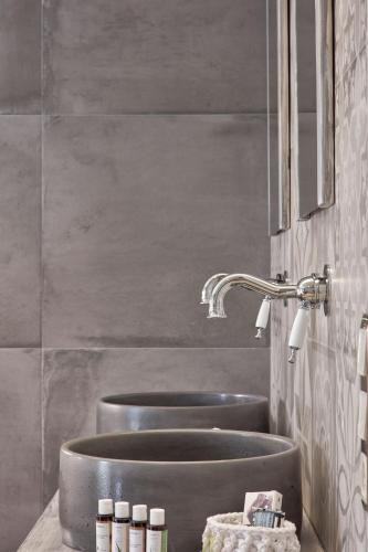 a bathroom with two sinks and a mirror at 18 Micon Str. in Athens