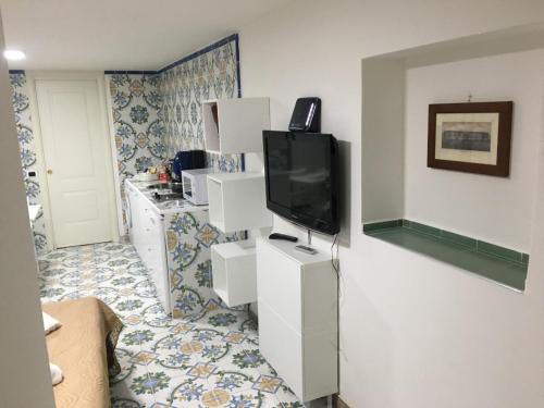 TV a/nebo společenská místnost v ubytování La Corte del Re Borbone