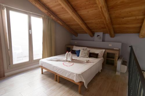 Säng eller sängar i ett rum på Villa Marietta Country House - Marche