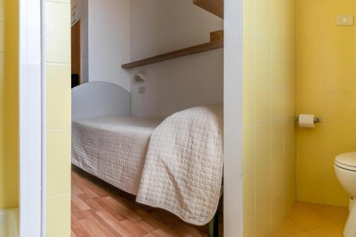 Postel nebo postele na pokoji v ubytování Hotel Stresa
