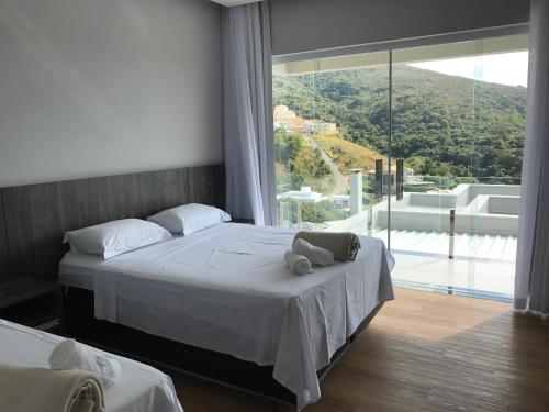 Postel nebo postele na pokoji v ubytování Suítes de Luxo Paraíso de Minas Escarpas