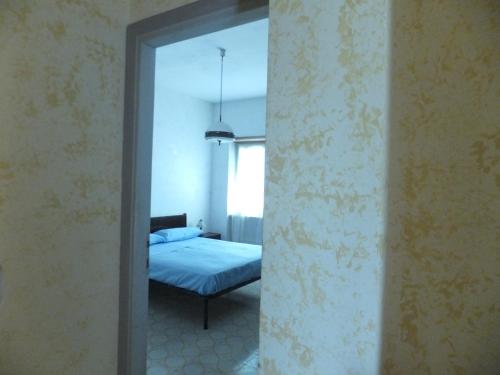 Postel nebo postele na pokoji v ubytování Complesso Riva di Badino