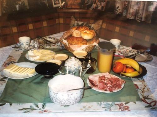 a table with a table cloth with food on it at Schusterhof in Innsbruck