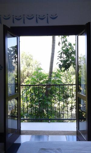 an open door to a balcony with a view at ece "vegan"hotel Bodrum in Golturkbuku
