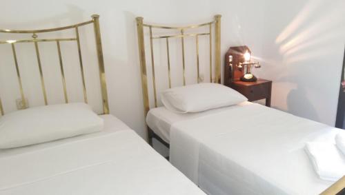 two beds sitting next to each other in a room at ece "vegan"hotel Bodrum in Golturkbuku