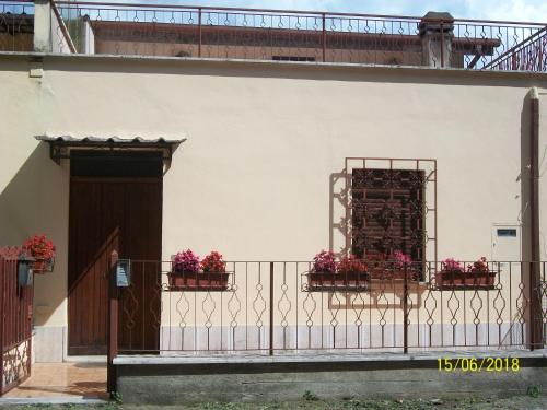 a balcony with flower boxes on a building at Sweet Home in Montopoli in Sabina