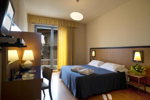 Posteľ alebo postele v izbe v ubytovaní Hotel Masini