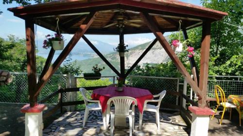 a gazebo with a table and chairs on a patio at Melnicani, Breathtaking view in Debar