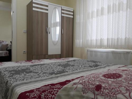 Postel nebo postele na pokoji v ubytování Cerit Pansiyon