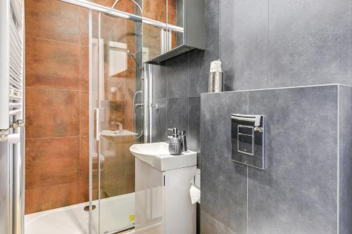 a bathroom with a shower and a toilet and a sink at Lion Apartments - Costa Brava Studio in Sopot