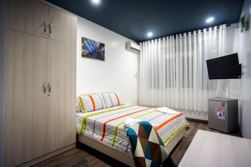 Tempat tidur dalam kamar di LeBlanc Saigon