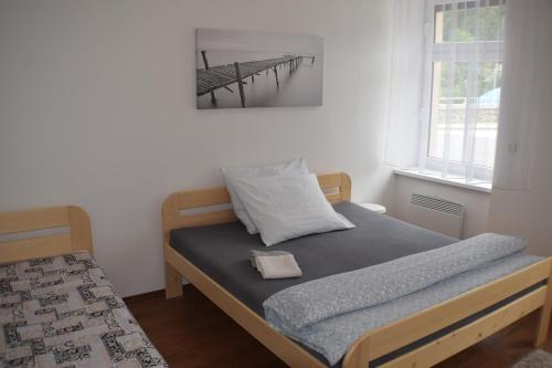 Postel nebo postele na pokoji v ubytování Apartmány Lípa