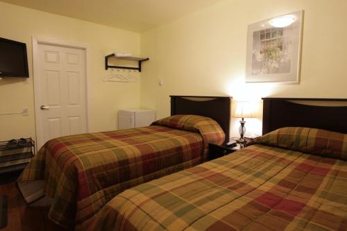 Un pat sau paturi într-o cameră la Cherry Tree Inn
