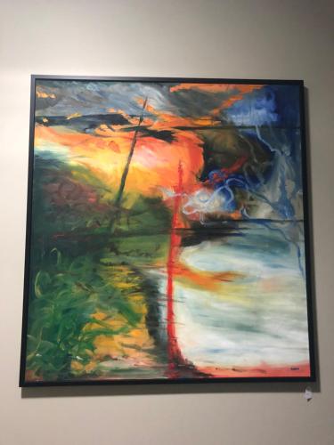 a painting is hanging on a wall at Teschemakers Resort in Oamaru
