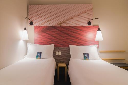 Katil atau katil-katil dalam bilik di ibis Erechim