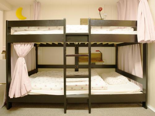 a bunk bed with two bunk beds in a room at Akasakano-sato(Premium) in Tokyo
