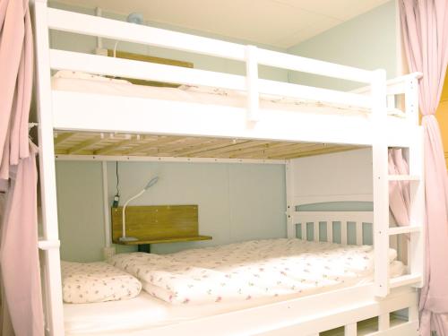 a bedroom with two bunk beds in a room at Akasakano-sato(Premium) in Tokyo