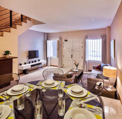 a living room with a dining table and a living room at Park Avenue Robertson in Singapore