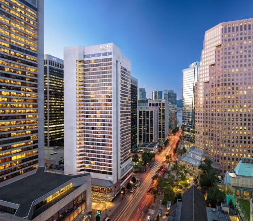 a view of a city with tall buildings at Hyatt Regency Vancouver in Vancouver