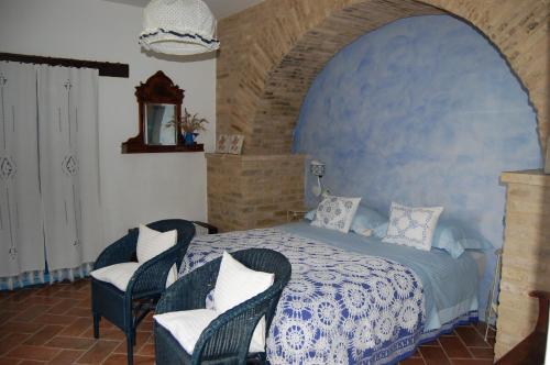 מיטה או מיטות בחדר ב-B&B Vento di Rose