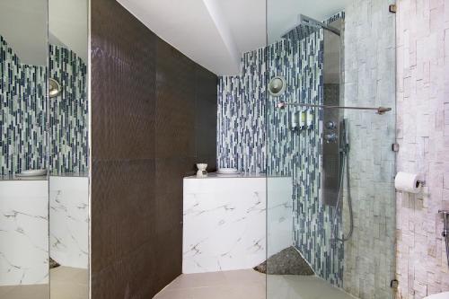 a bathroom with a shower with a glass door at Sunshine Ocean Sea View in Chaweng