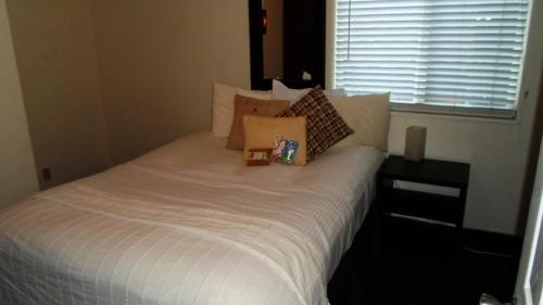 Una cama o camas en una habitación de Paradice Motel