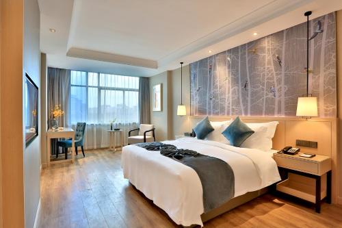 Postel nebo postele na pokoji v ubytování Byland Star Hotel