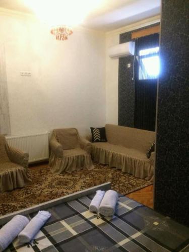 a living room with a couch and a table at Guesthouse Raisa in Kvareli