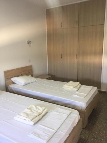 Postel nebo postele na pokoji v ubytování Kasapis Apts