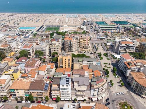 an aerial view of a city with buildings and the ocean at Hotel Ragno D'Oro in Sottomarina