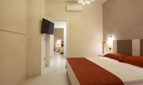 En eller flere senger på et rom på Ferrocino Resort