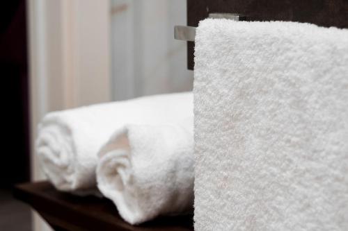 two rolls of toilet paper sitting on a shelf at Al Campanile di San Daniele in San Daniele del Friuli