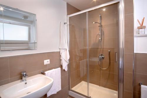 a bathroom with a shower and a sink at Mamima studio in Sorrento