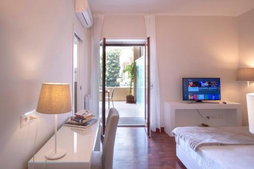 a bedroom with a bed and a table with a lamp at Mamima studio in Sorrento