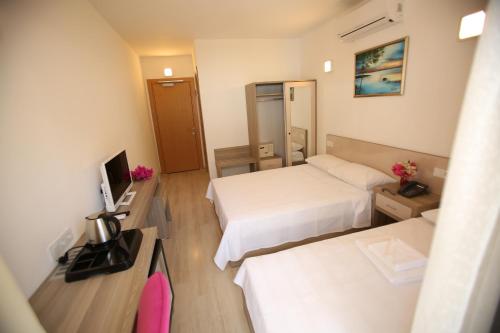 Katil atau katil-katil dalam bilik di Aria Doria Otel