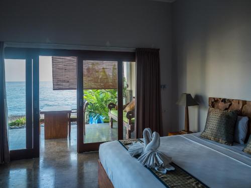 Ένα ή περισσότερα κρεβάτια σε δωμάτιο στο Amed Beach Villa