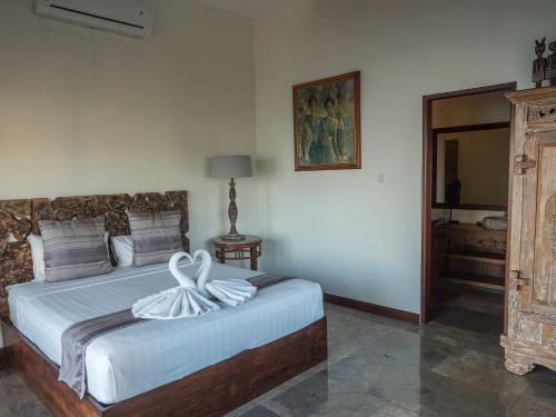 Ένα ή περισσότερα κρεβάτια σε δωμάτιο στο Amed Beach Villa