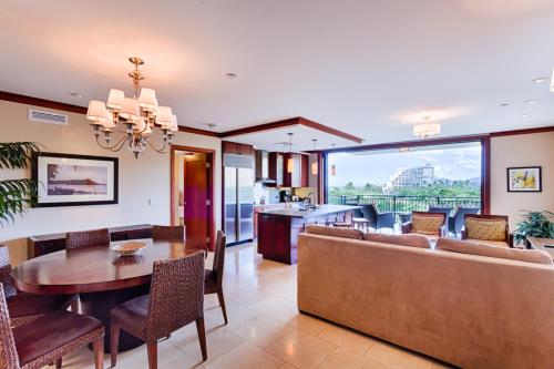 a living room with a couch and a table at Fifth Floor UPGRADED Villa with Sunset View - Beach Tower at Ko Olina Beach Villas Resort in Kapolei