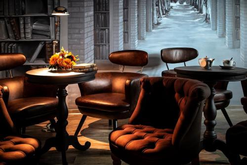 a bar with chairs and tables and a street at Ciarus in Strasbourg