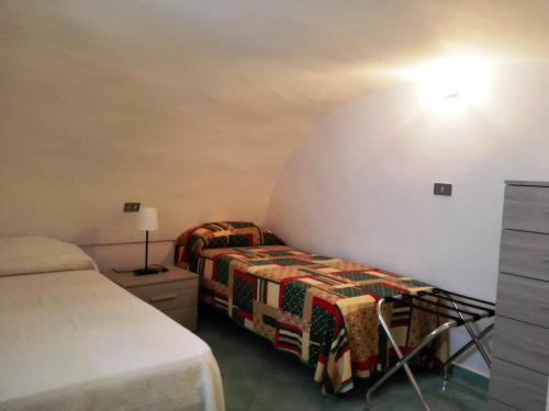 En eller flere senge i et værelse på VisitPonza - Trilocale sul corso