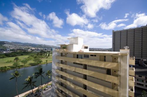 a view of a building and a river at Skyline Island Colony Hotel in Honolulu
