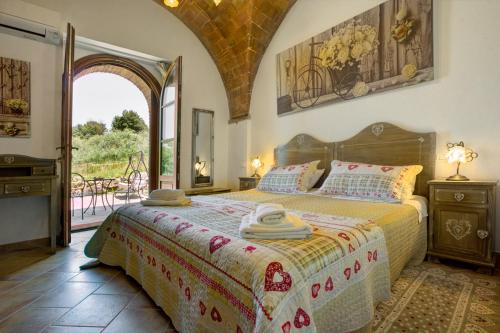 Postel nebo postele na pokoji v ubytování In Canto Sul Poggio