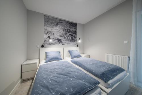 Postel nebo postele na pokoji v ubytování Apartament Pod Lasem