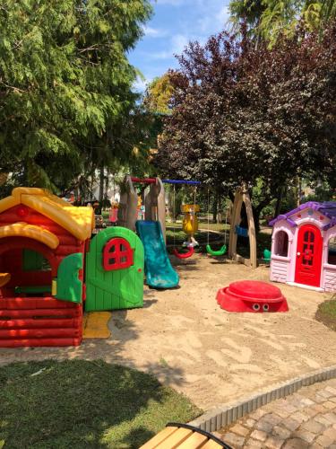 a playground with many play equipment in a park at Dreamland oasis in Chakvi in Chakvi